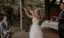 The bride bids farewell to her old name in a German-American wedding ceremony near Kaiserslautern