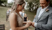 German-American wedding couple exchanges rings in their wedding ceremony near Kaiserslautern, Germany